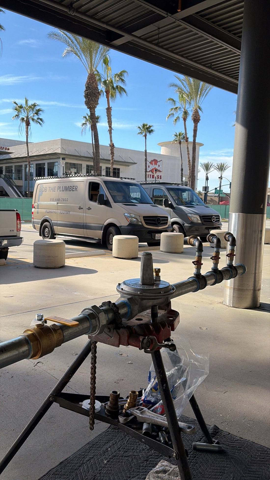 Bob The Plumber service vans on location